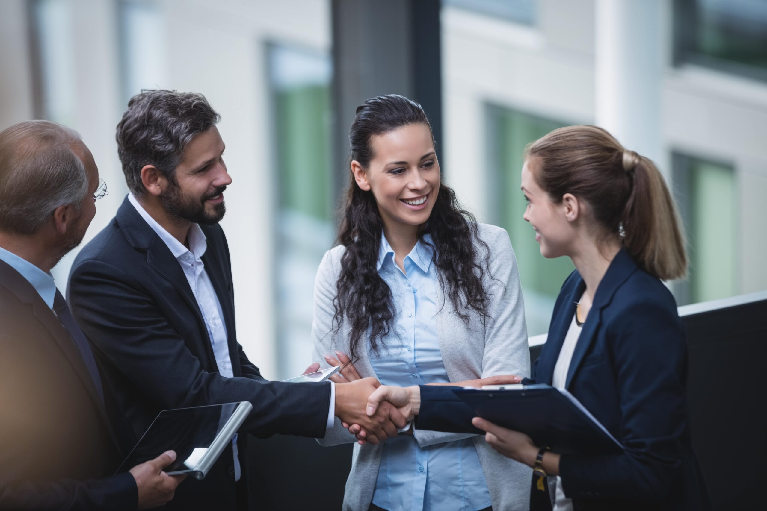 businesspeople-having-discussion-in-office-min